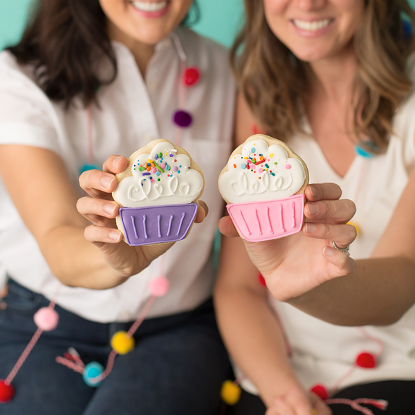 Gourmet cupcake sugar cookies hand-decorated with royal icing and topped with rainbow sprinkles.