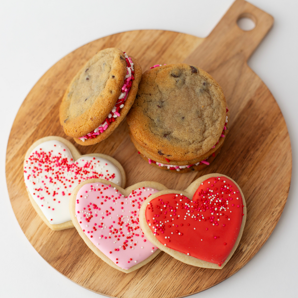 Valentine's heart-shaped sugar cookies and chocolate chip buttercream sammies with sprinkles